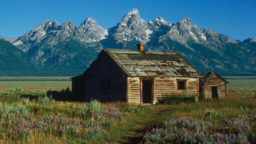 Jackson Hole que incluye arquitectura patrimonial, una casa y montañas