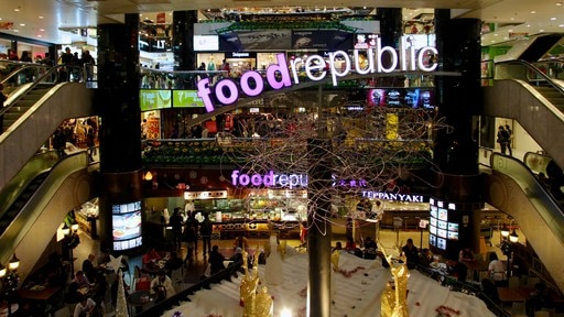 Tsim Sha Tsui which includes shopping, signage and interior views
