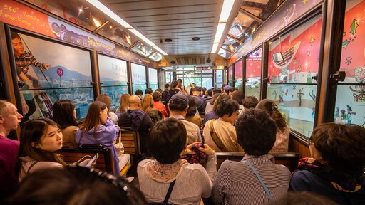 The Peak Tram showing railway items and interior views as well as a large group of people