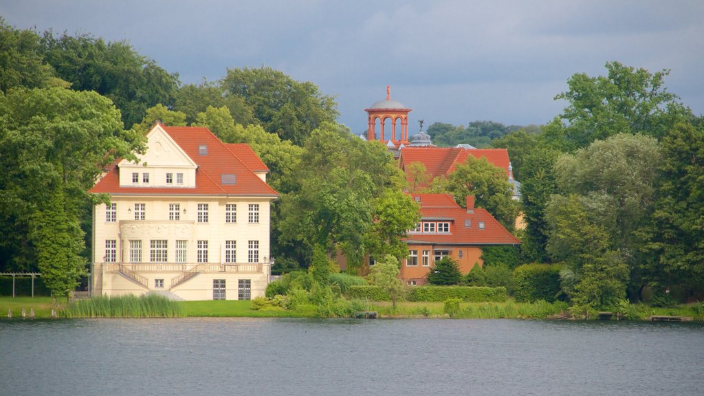 Potsdam which includes a lake or waterhole, a house and heritage architecture