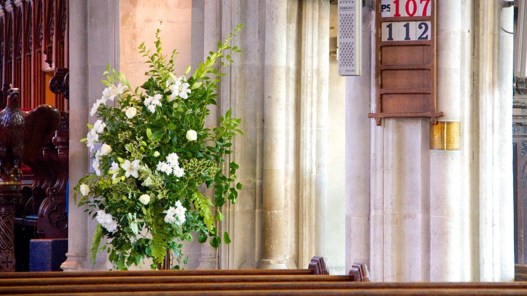 Church of St. Mary the Great featuring flowers, a church or cathedral and interior views