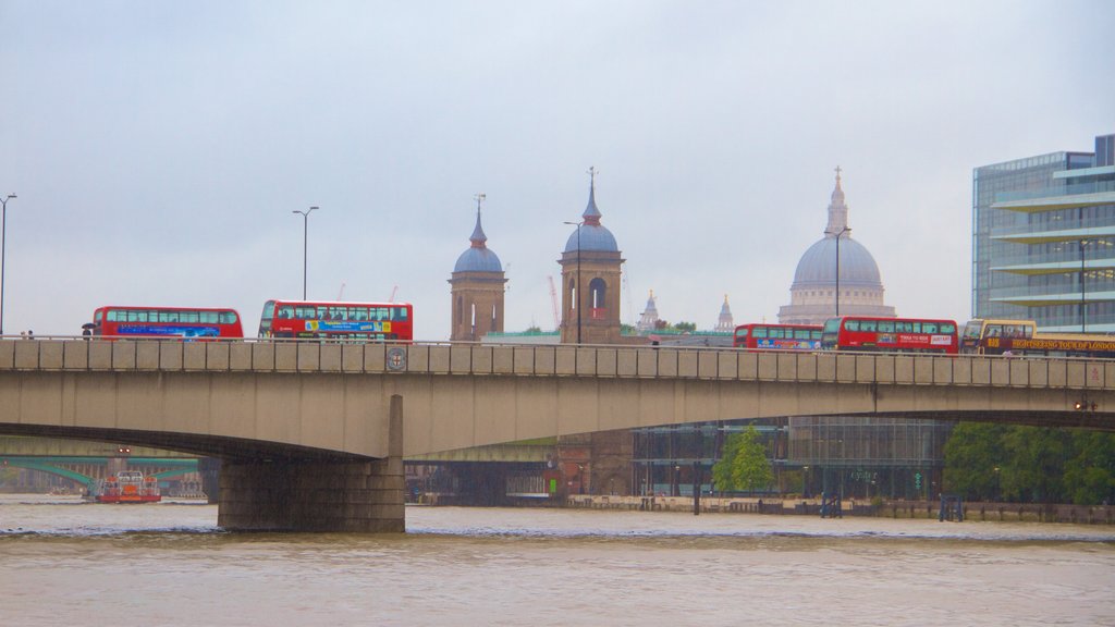 London Bridge which includes a city, a bridge and a river or creek