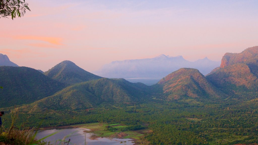 Kodaikanal which includes mountains, tranquil scenes and a sunset