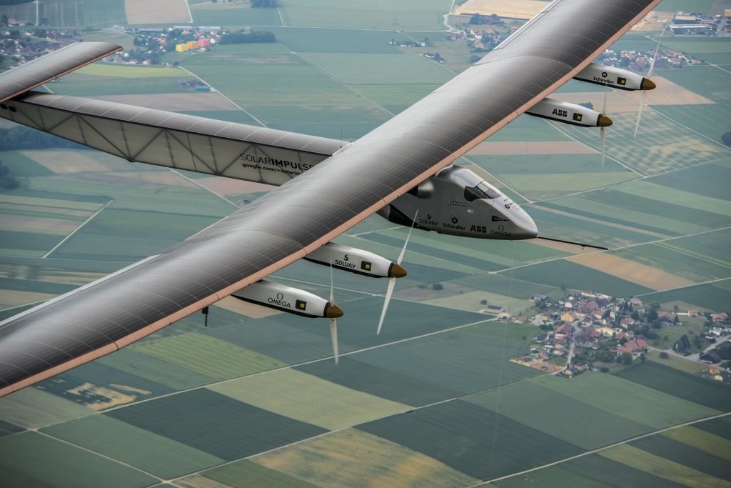 Zukunft des Reisens in Payerne, Switzerland: Today,<figcaption>Solar Impulse 2</figcaption>, the second single-seater solar aircraft of Bertrand Piccard and André Borschberg designed to take up the challenge of the first round-the-world solar flight, without any fuel in 2015, carried out its first flight out of the Payerne aerodrome in Switzerland. There will be several other test flights taking place in the coming months in order for this experimental machine to attain certification. They will be followed by training flights of Bertrand Piccard and André Borschberg later in the season still from Payerne airfield. The attempt to make the first round-the-world solar-powered flight is scheduled to start in March 2015 from Gulf area. Solar Impulse will fly, in order, over the Arabian Sea, India, Burma, China, the Pacific Ocean, the United States, the Atlantic Ocean and Southern Europe or Northern Africa before closing the loop by