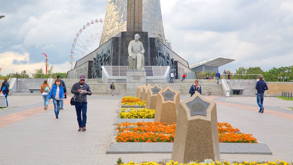 Monument to the Conquerors of Space which includes a monument as well as a small group of people