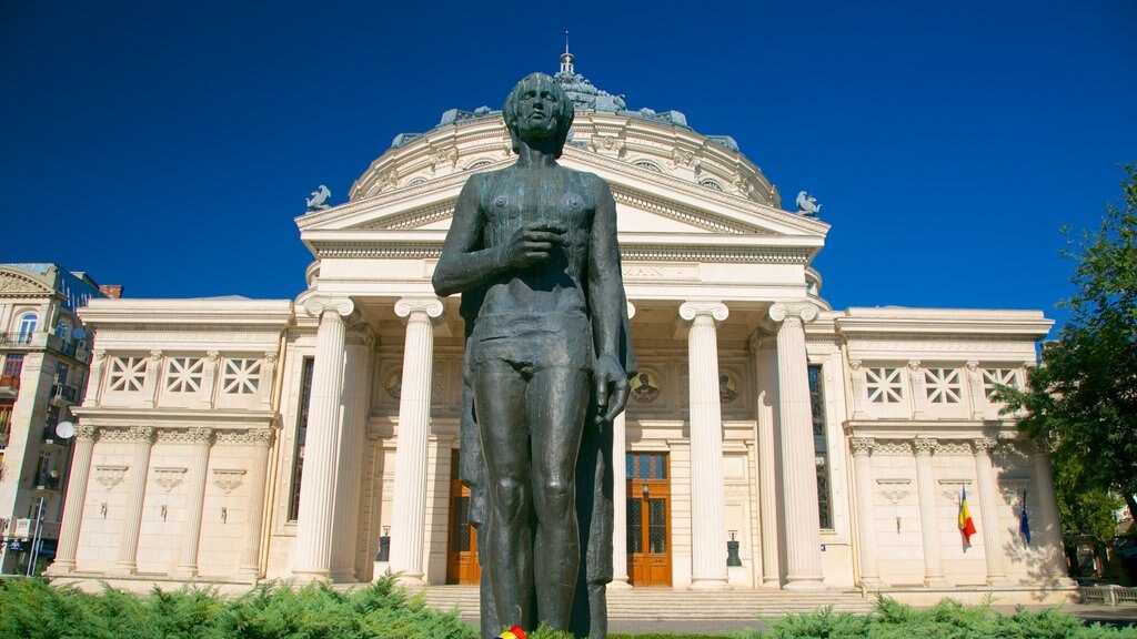 Romanian Athenaeum showing a statue or sculpture, theater scenes and heritage architecture