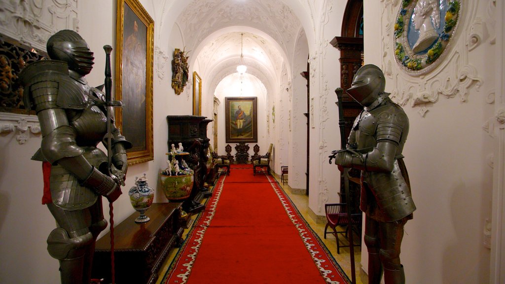 Peles Castle which includes interior views, a castle and military items