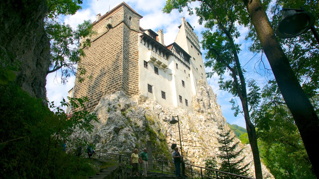 Bran Castle featuring a castle and heritage architecture