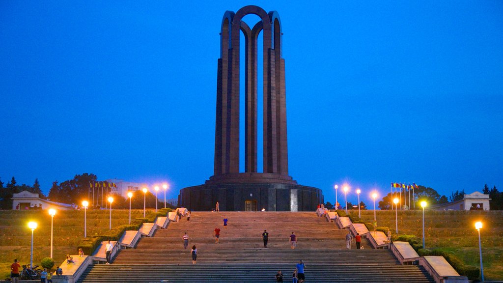 Carol Park which includes a monument, a garden and night scenes