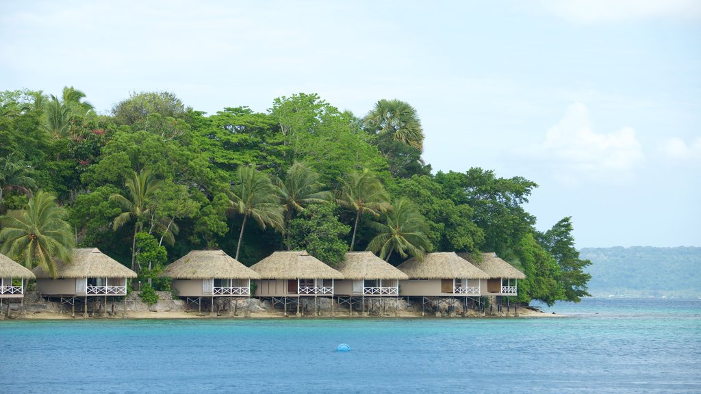 Isla Iririki que incluye vistas generales de la costa, una casa y escenas tropicales