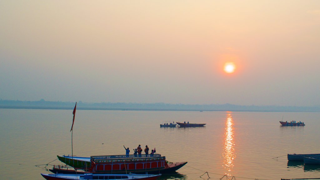 Tulsi Ghat showing boating, kayaking or canoeing and a sunset