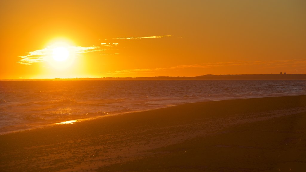 Sandy Neck Beach featuring a sunset and general coastal views