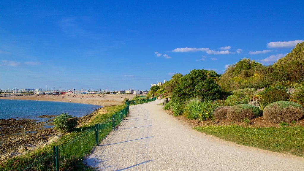 Minimes Beach featuring a sandy beach and a garden