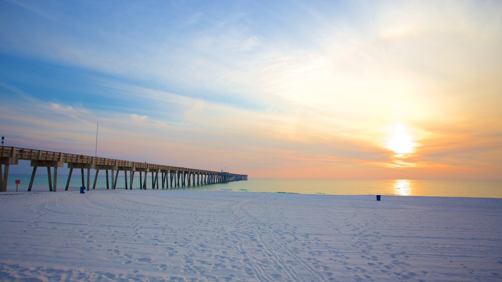 Pier Park showing a sunset and a beach