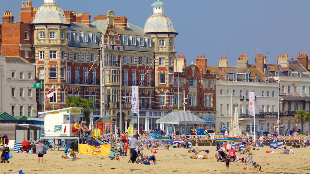 Weymouth Beach which includes a beach as well as a large group of people