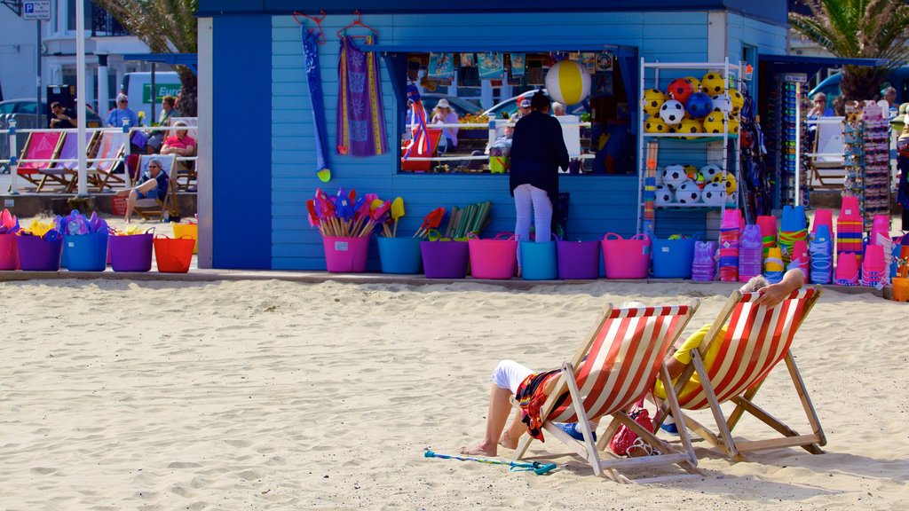 Weymouth Beach mostrando compras e uma praia de areia