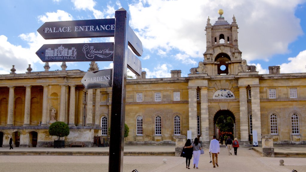 Blenheim Palace which includes signage, heritage elements and a square or plaza