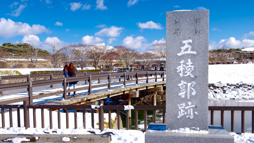 Fort Goryokaku featuring signage and snow