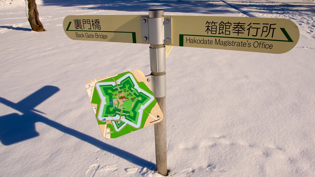 Fort Goryokaku featuring signage and snow