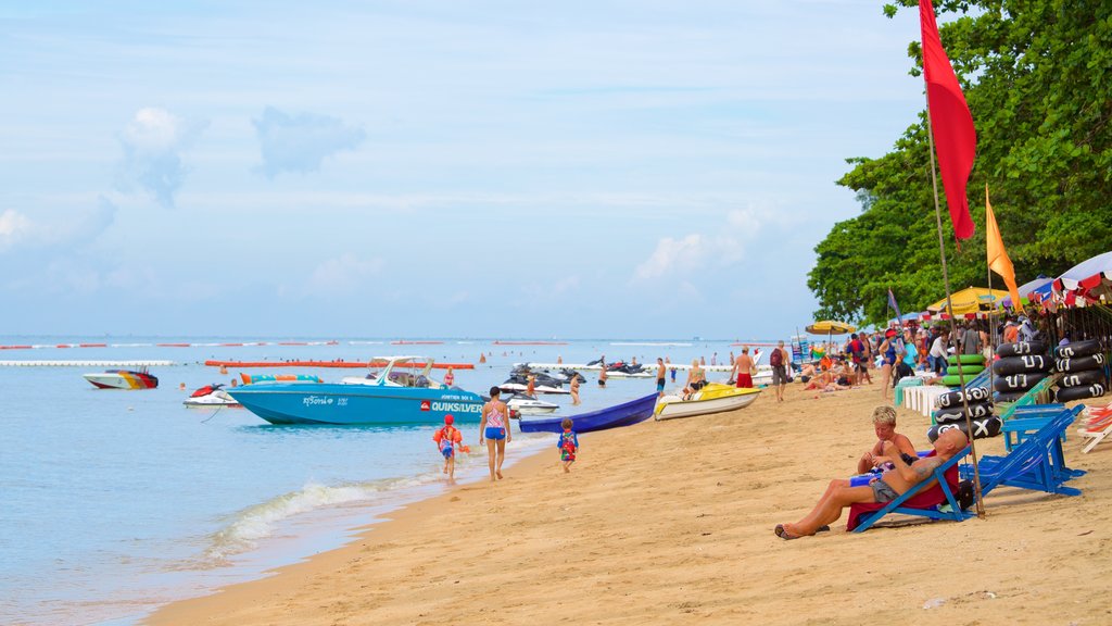 Jomtien Beach which includes a sandy beach as well as a large group of people