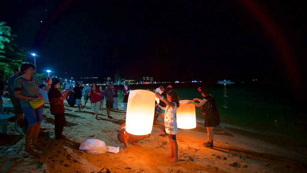 Pattaya Beach showing a sandy beach, a sunset and a festival