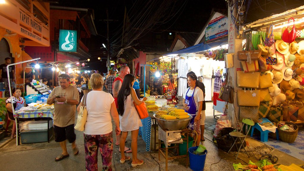 Fisherman\'s Village featuring night scenes and markets as well as a large group of people