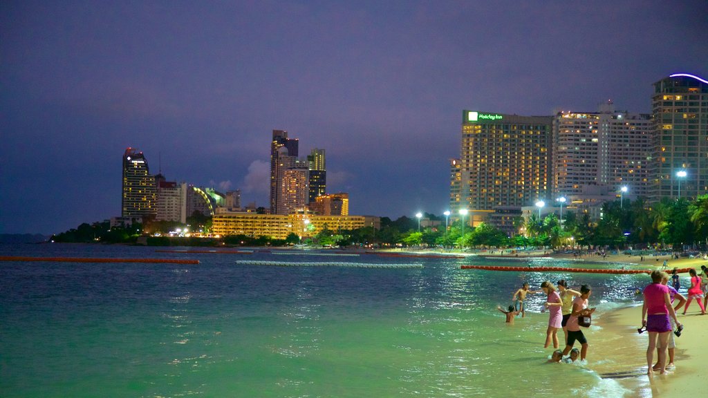 Pattaya Beach showing night scenes and city views as well as a large group of people