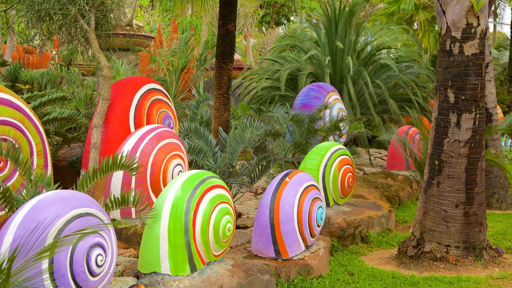 Nong Nooch Tropical Botanical Garden showing a garden and outdoor art