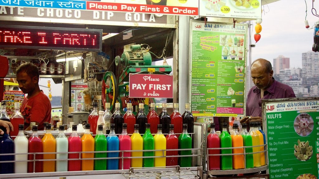 Girgaun Chowpatty showing shopping as well as a small group of people