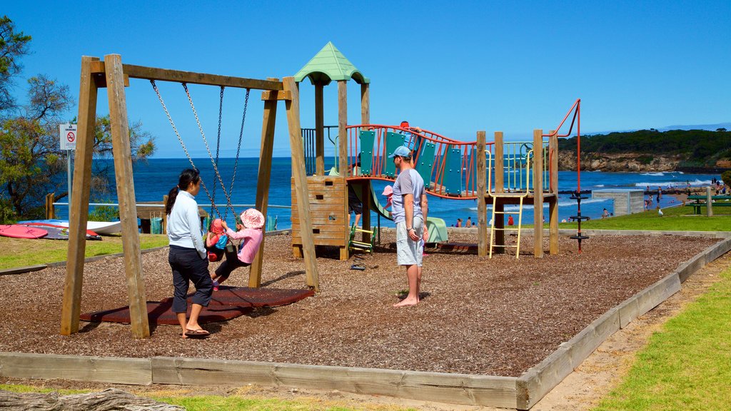 Point Lonsdale showing a playground as well as a family