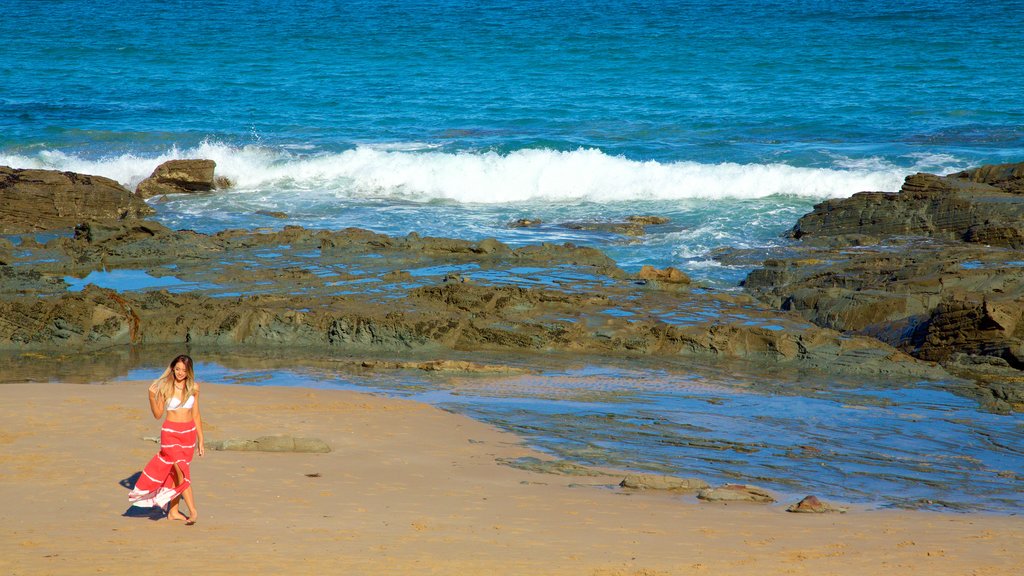 Lorne featuring rocky coastline as well as an individual female