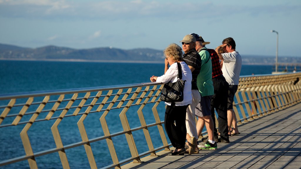 Lorne featuring general coastal views as well as a large group of people