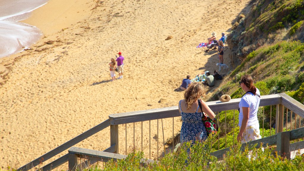 Bell\'s Beach showing views and general coastal views as well as a small group of people