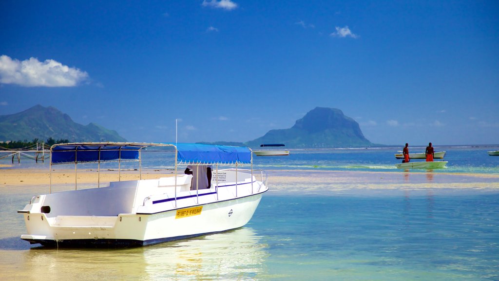 Flic-en-Flac showing boating and general coastal views as well as a small group of people