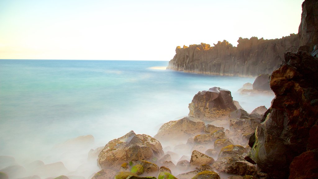 Cape Mechant which includes rocky coastline and mist or fog