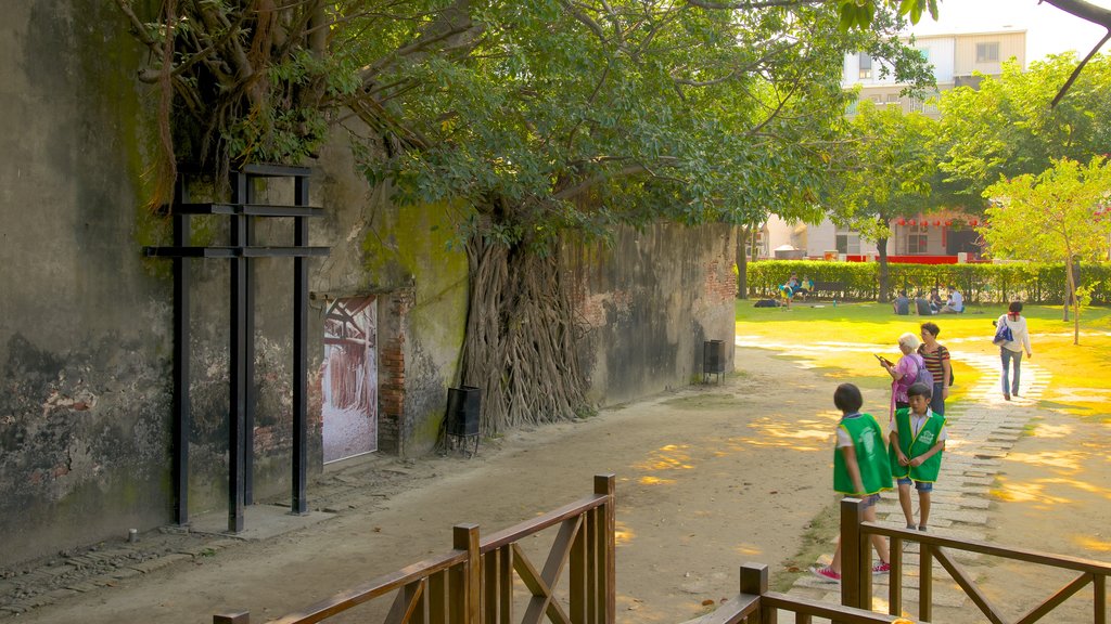 Anping Tree House showing a park as well as a small group of people