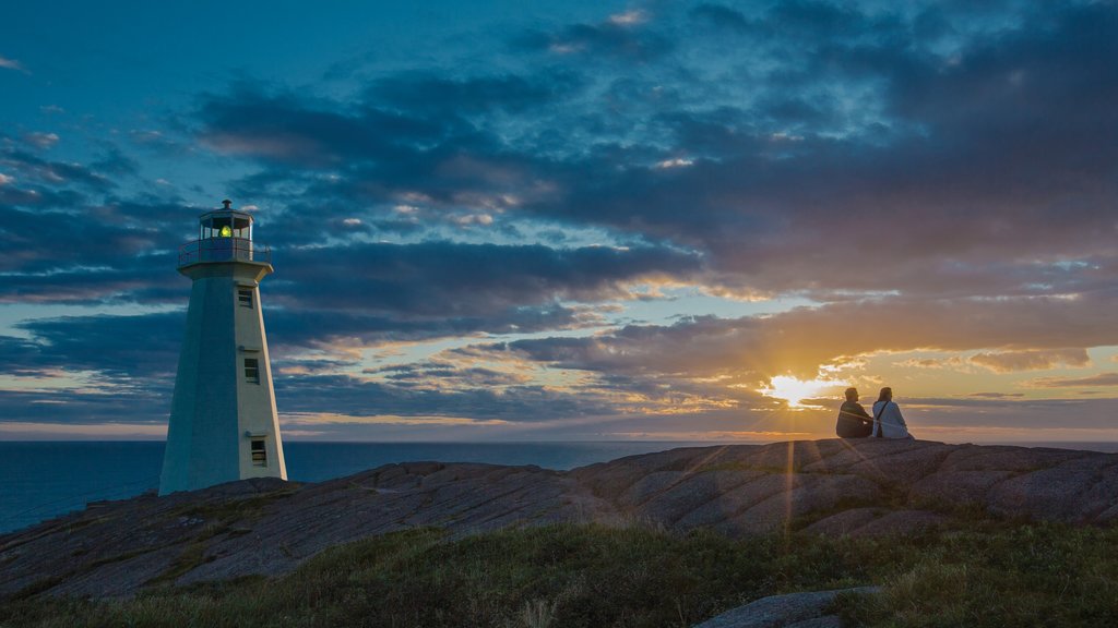 Newfoundland and Labrador featuring a sunset, a lighthouse and general coastal views