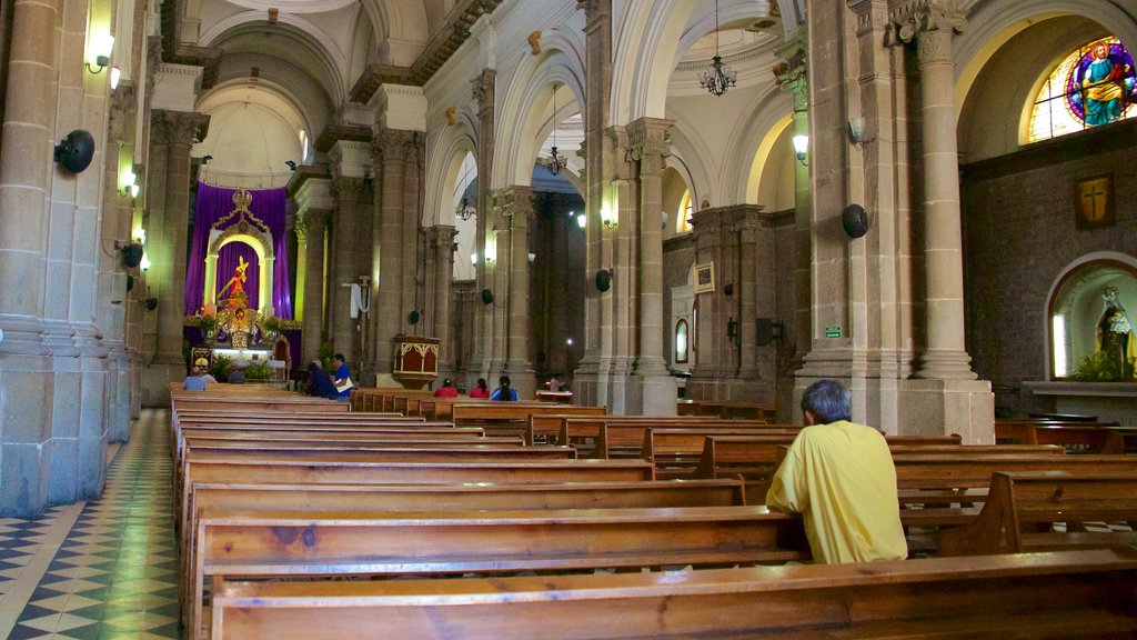 Quetzaltenango Cathedral showing a church or cathedral and interior views as well as an individual male