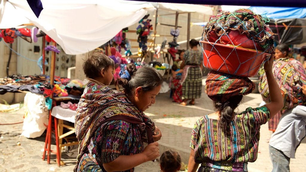 Panajachel Municipal Market showing markets as well as a small group of people