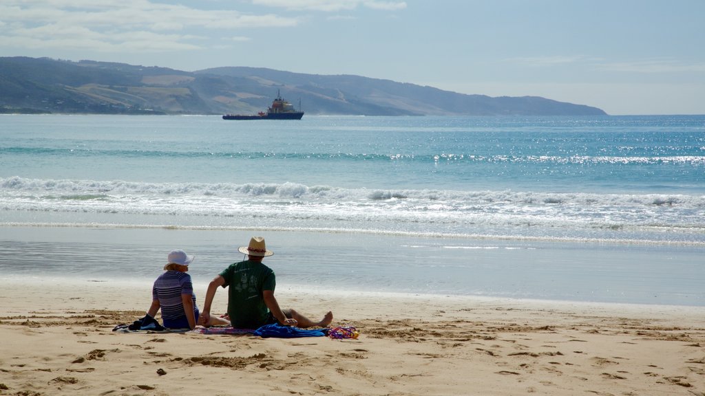 Apollo Bay showing a beach as well as a couple