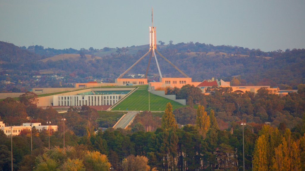 Parliament House which includes an administrative building and a sunset