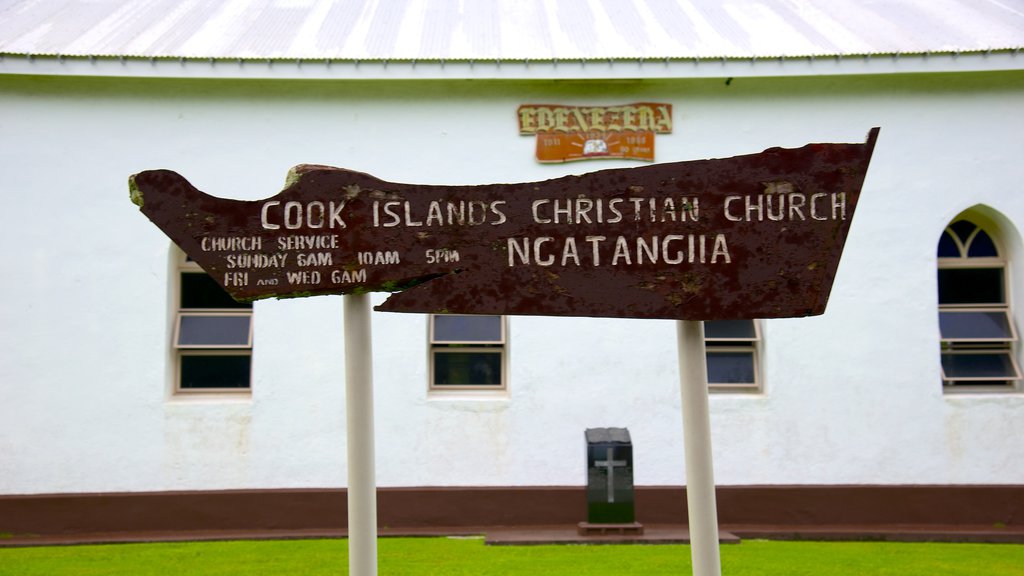 Ngatangiia which includes a church or cathedral and signage