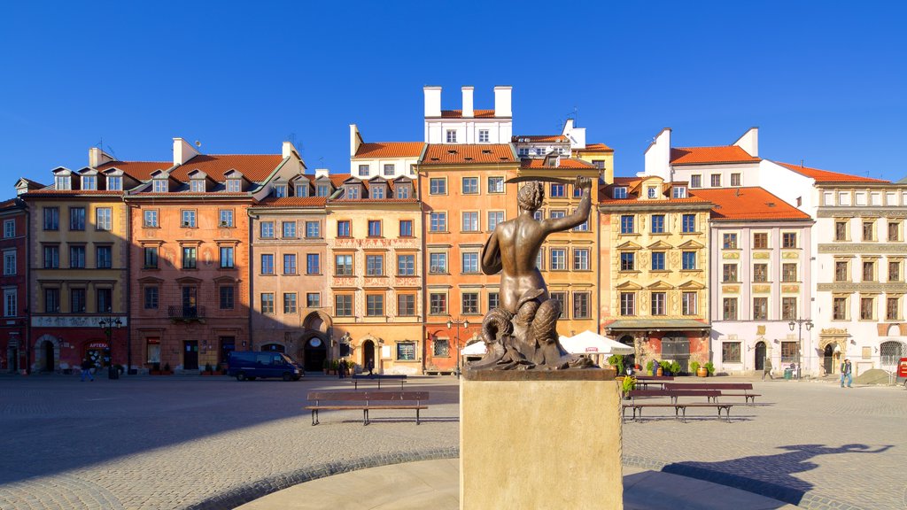 Warsaw Mermaid Statue which includes a square or plaza and a statue or sculpture