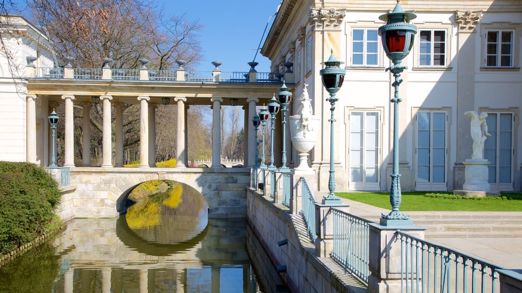 Lazienki Palace showing a river or creek and château or palace