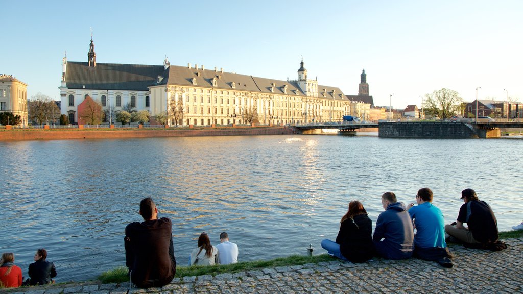 Wroclaw University showing a river or creek as well as a small group of people