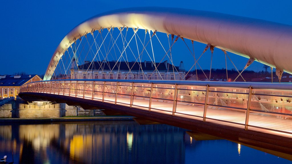 Krakow showing a bridge and night scenes