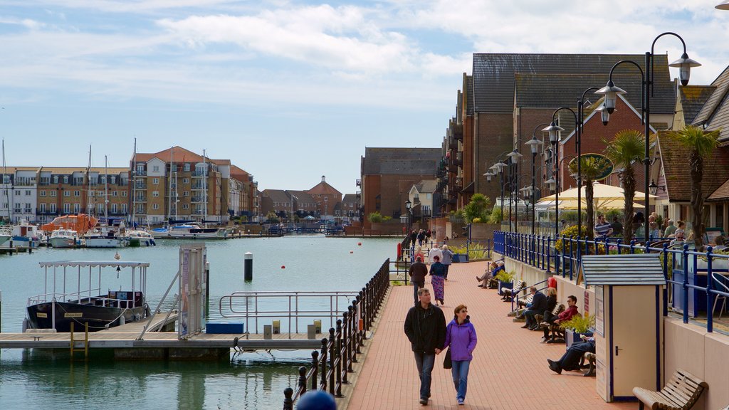 Sovereign Harbour showing a marina and a city as well as a couple