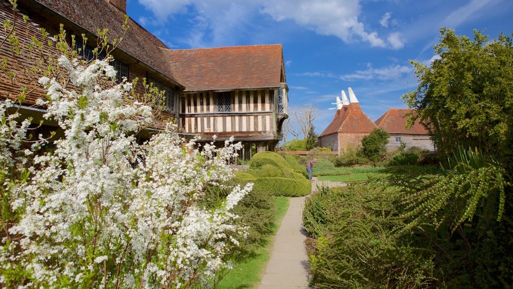 Great Dixter House and Gardens showing heritage elements and a garden