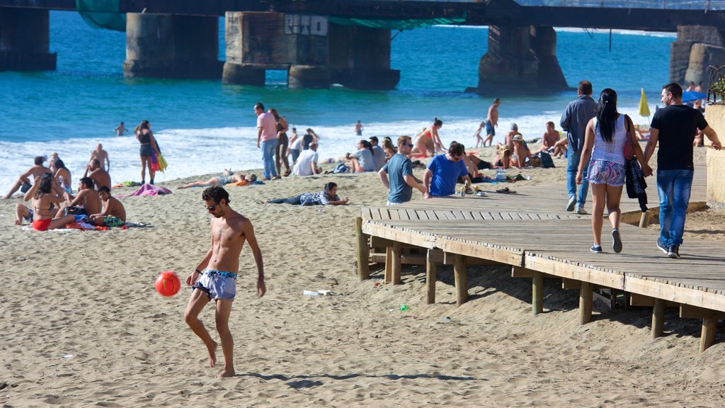 Acapulco Beach showing a beach as well as a small group of people