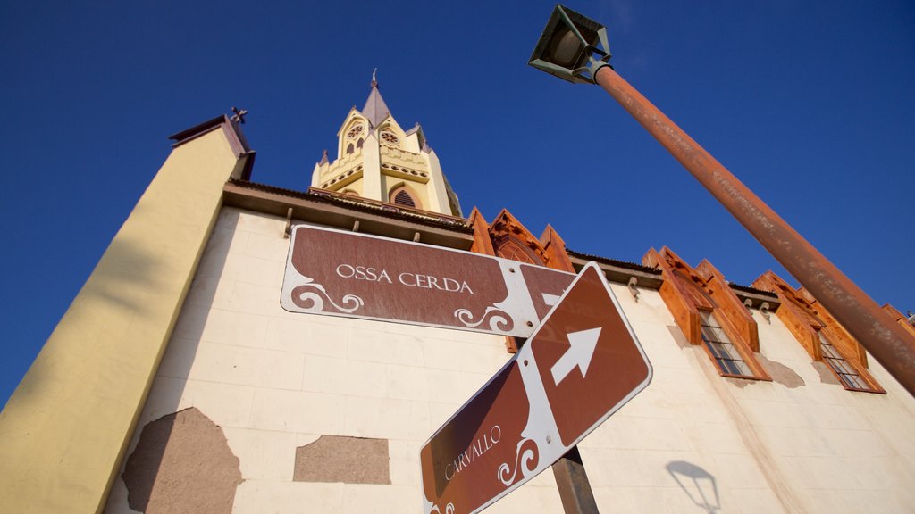 Iglesia San Francisco featuring a church or cathedral and signage